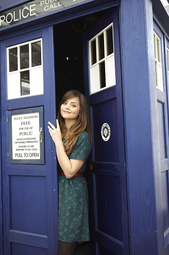 Jenna Coleman in front of the TARDIS